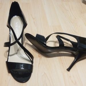 Nine West  size 11 black patent leather heeled sandle. Never worn.